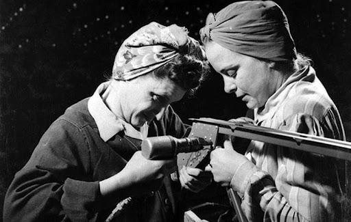 Black and white photo of two female industrial workers