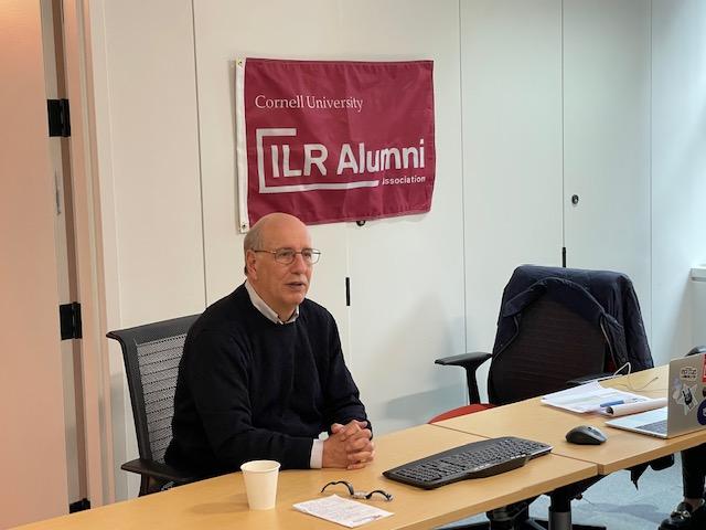 Harry Katz sits at table