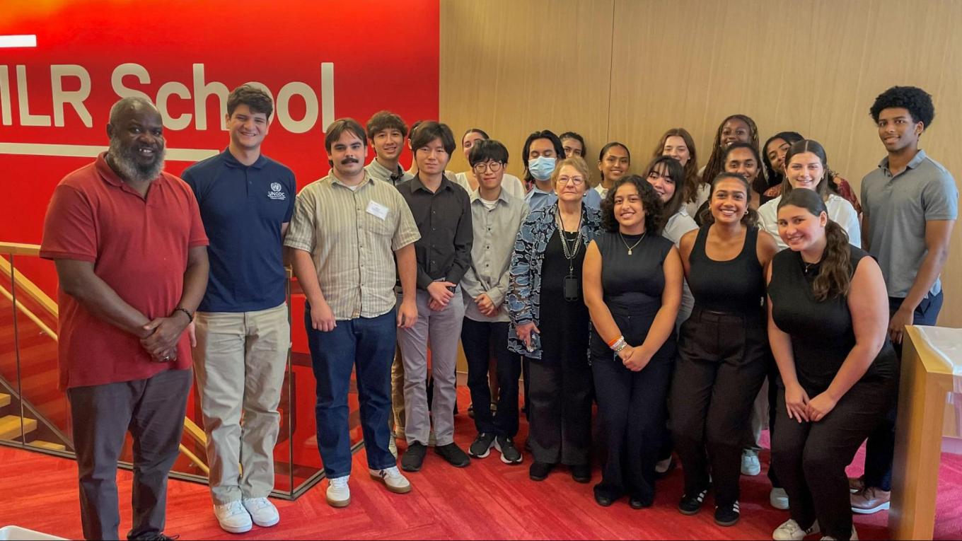 Robert Taylor (left) poses with the 2024 High Road NYC Fellows.