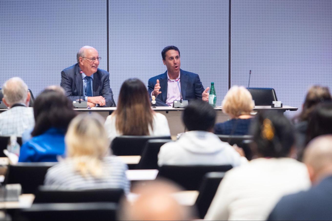 Panelists speaking to audience