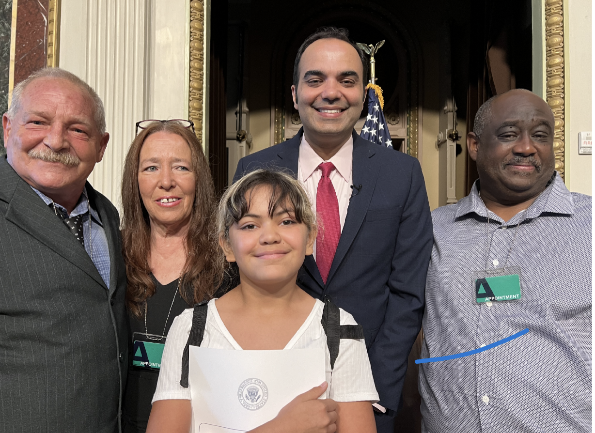 Paul Sugar and family, George Curlee, and CFPB Director, Rohit Chopra.