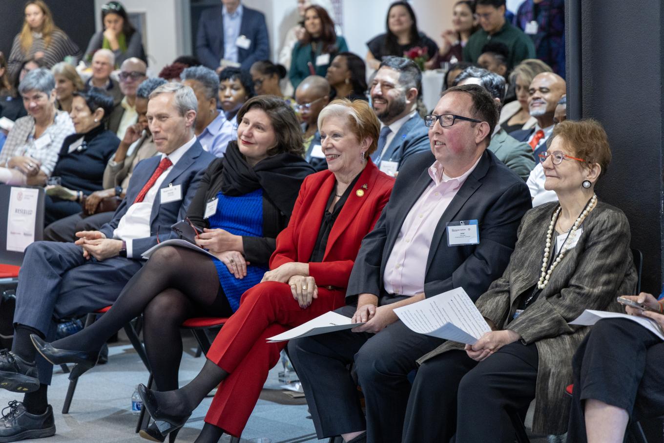 Dean Alex Colvin, Anne Marie Brady, Roberta Reardon, Ariel Avgar, Esta Bigler sitting front row of audience