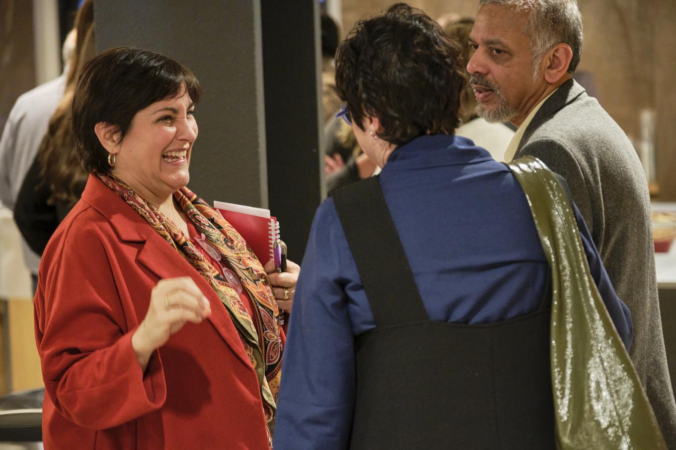 Diane Burton, Sarah Krasley, and Sarosh Kuruvilla speak with each other at the 2025 Global Labor Institute conference in New York City