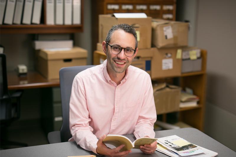 Eli Freidman working in ILR's Kheel Center.