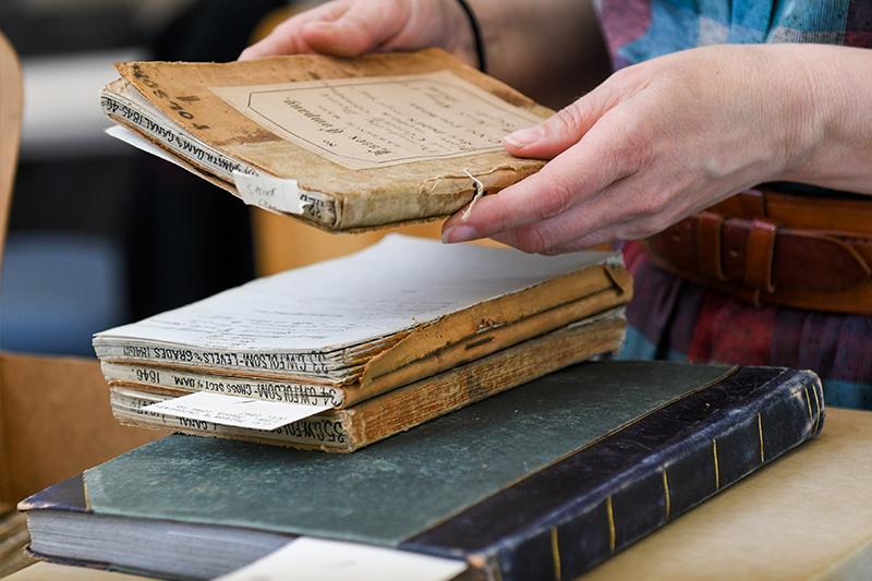 stack of older looking ledgers