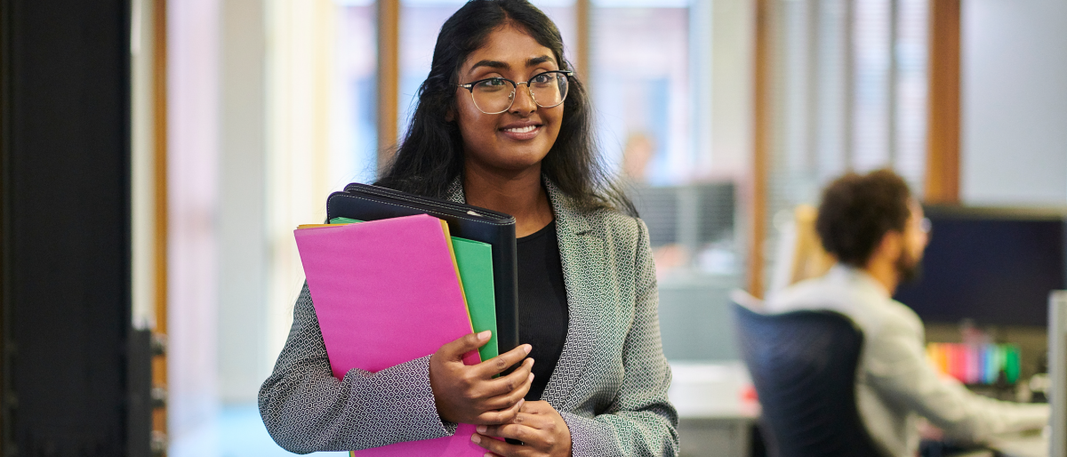 Woman holding a binder
