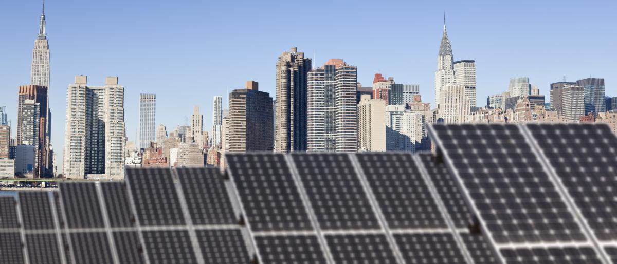 NYC skyline with solar panels on bottom half of image