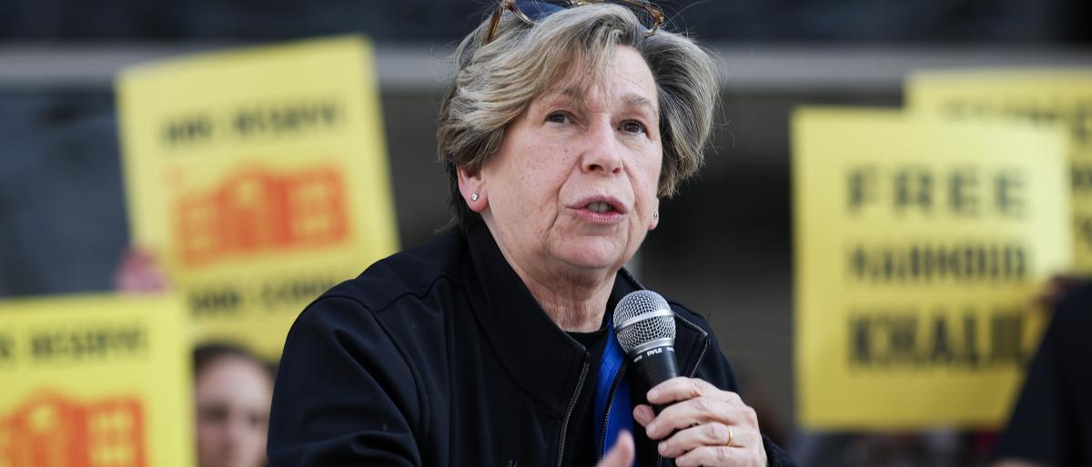 Randi Weingarten speaking into a microphone