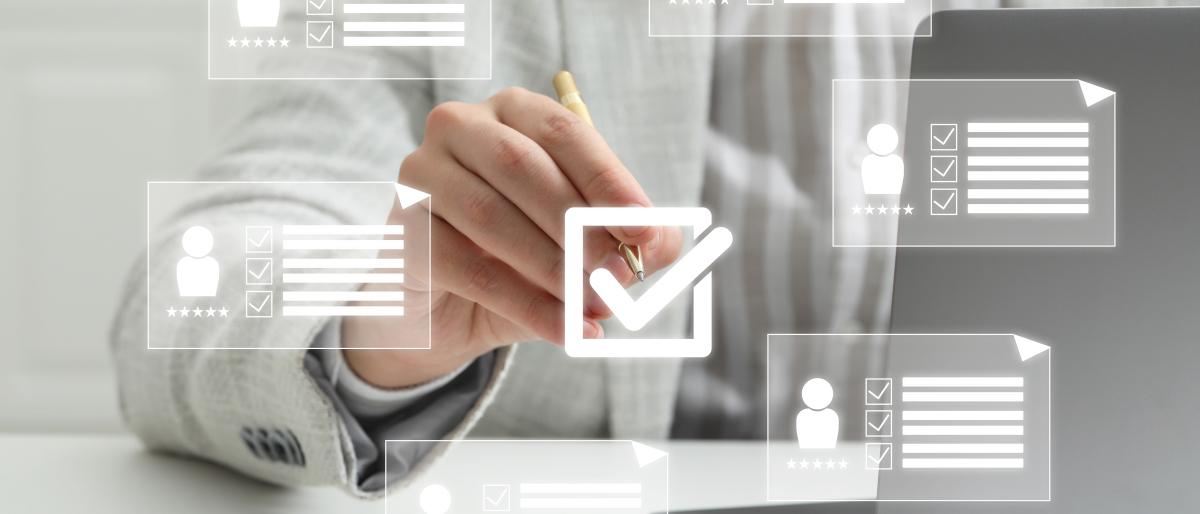 Close up of person putting check mark on virtual screen with icons