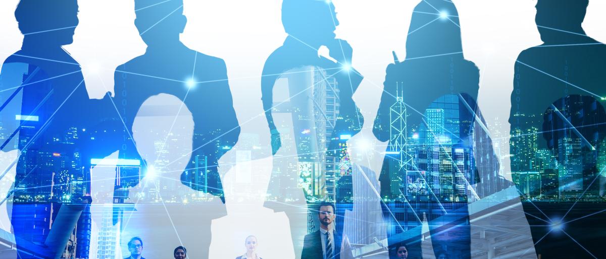 Silhouettes of business professionals standing and conversing, overlaid with a city skyline and digital network lines, representing collaboration, leadership, and a connected workforce.