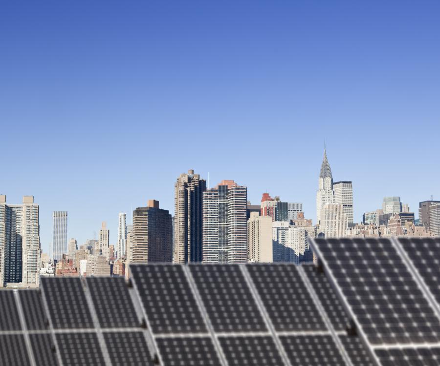 NYC skyline with solar panels on bottom half of image
