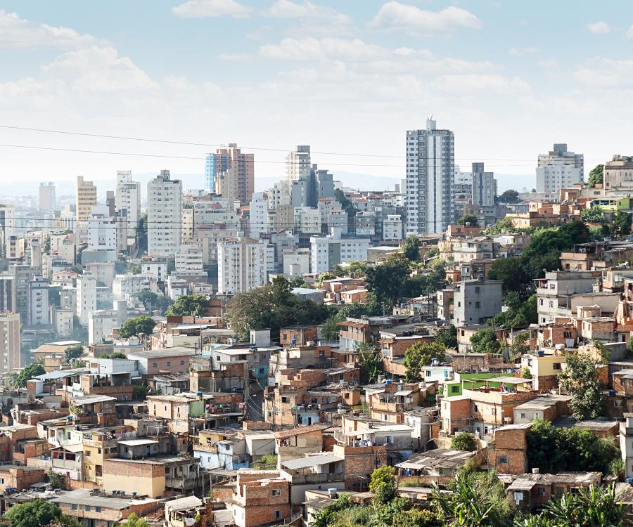 Image of city skyline with one side with high rises, the opposite with smaller homes