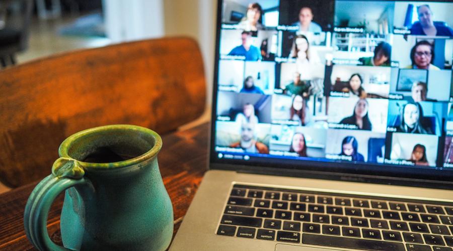 a laptop showing a video call to illustrate remote connection like an interview