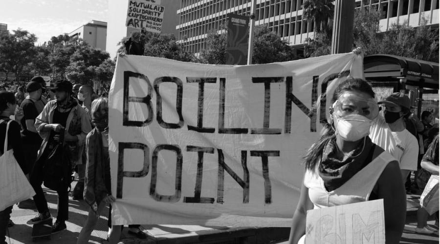 Protesters hold a sign saying "Boiling Point" during protests against the killing of George Floyd.