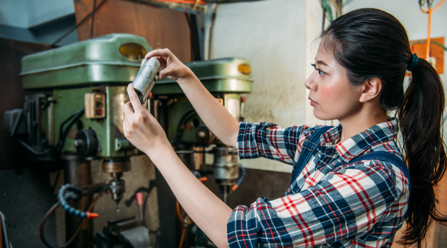 Female Worker Holding Silver Parts Components