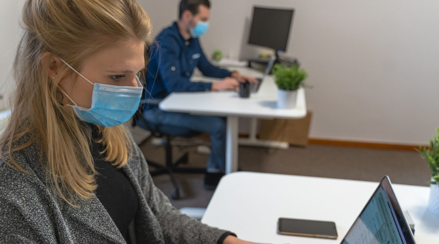 Workers at a desk with the mask