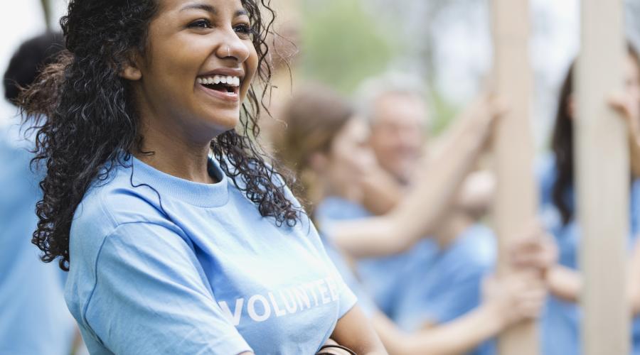 A young woman volunteers in her community.