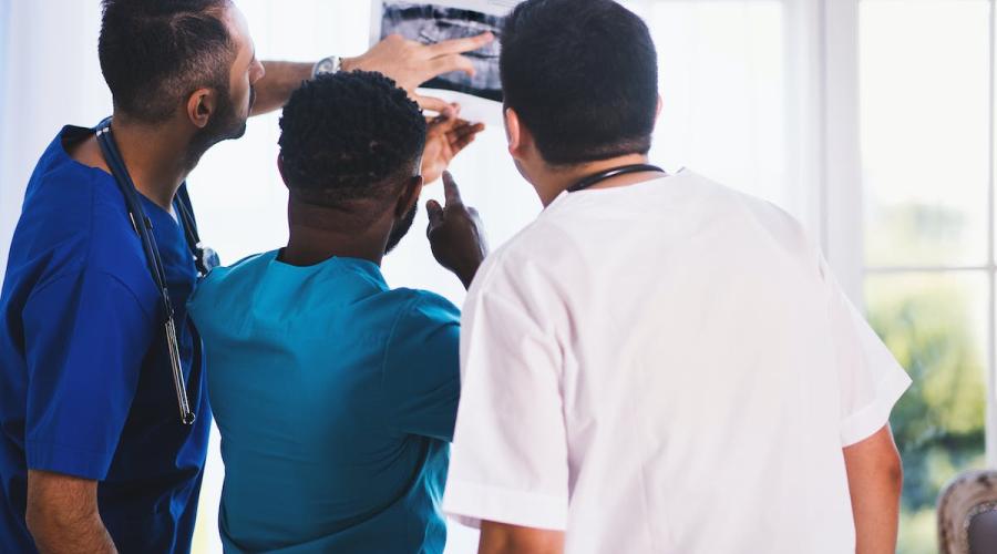 Doctors examining a medical photograph