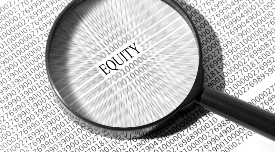 A magnifying glass placed over the word equity