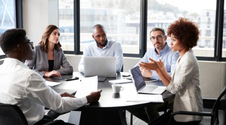 People sitting at a round table. 