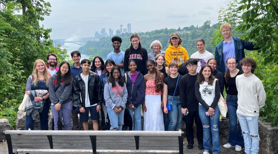 High Road Fellows stand with Niagara Falls and Canada in background