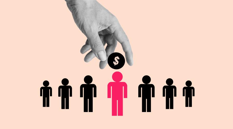 Photo of a hand selecting one person figure out of a line of figures, with a dollar sign over its head.