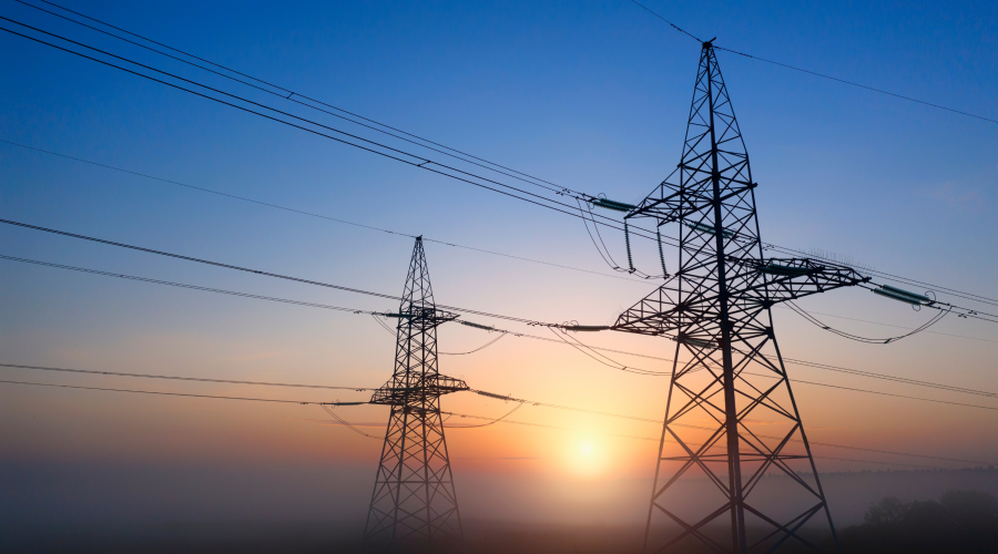 Transmission lines with the sun setting in the background