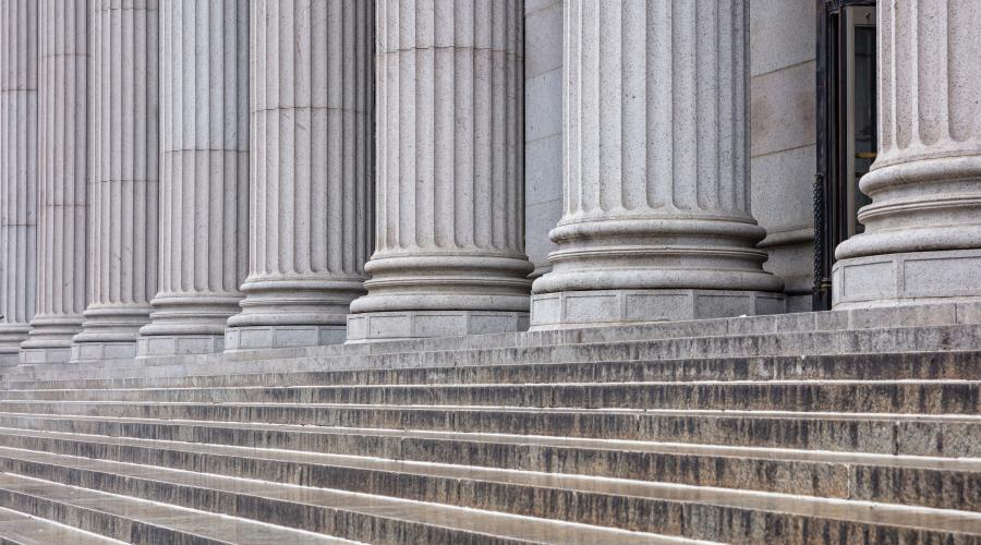Photo of the base of large columns on a building