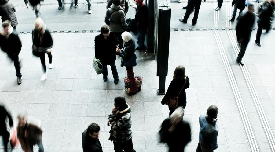 Photo of people milling around building atrium