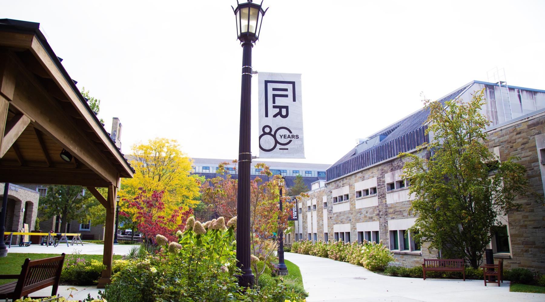 An ILR 80th Anniversary banner hanging in Golden Courtyard