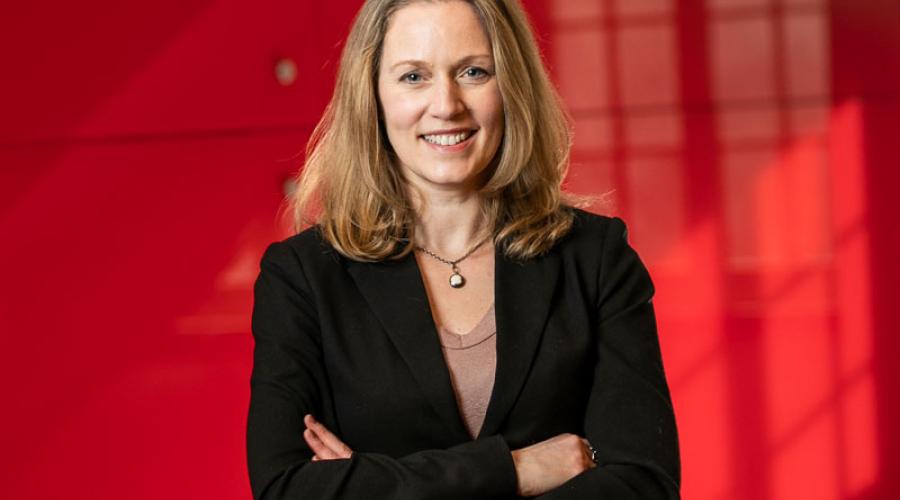 Associate Professor Vanessa Bohns in the hallway of the Ives Faculty Building.