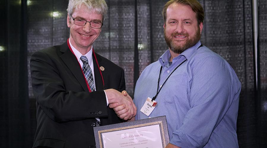 Christian Miller is presented with the University’s President’s Awards for Employee Excellence at the seventh annual Employee Recognition 