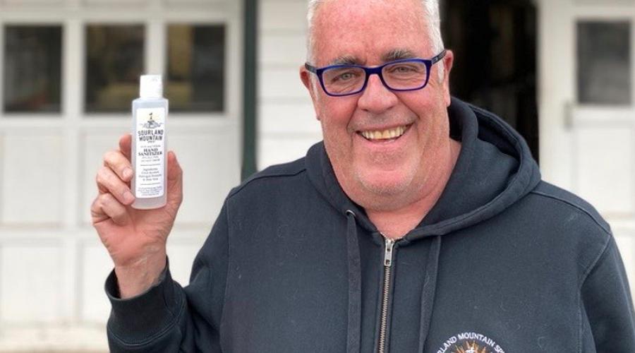 Raymond Disch ’80 with a bottle of hand sanitizer produced by his company, Sourland Mountain Spirits.