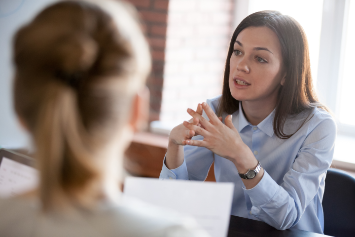 Woman negotiating with others