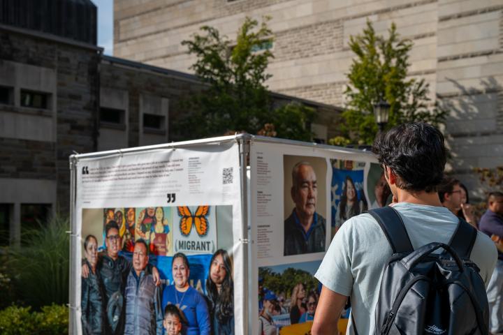 Student looking at TPS exhibit in Ithaca NY