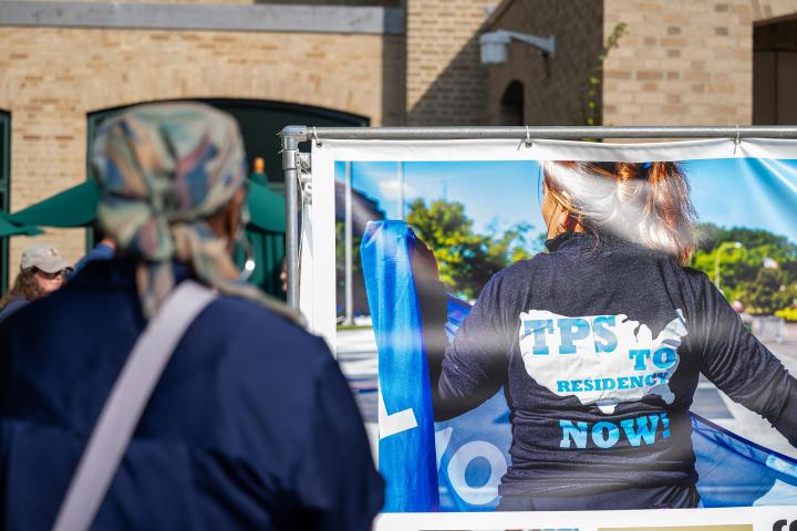 Woman looking at TPS exhibit