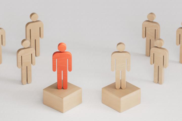 blocks of people showing one as a leader
