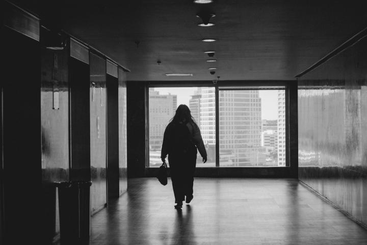 person walking in hallway