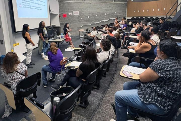 Classroom with students and teachers facilitating at the front