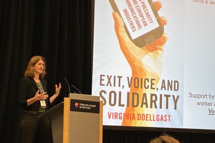 Virginia Doellgast presenting the keynote address at the 2025 SASE annual conference in Quebec.