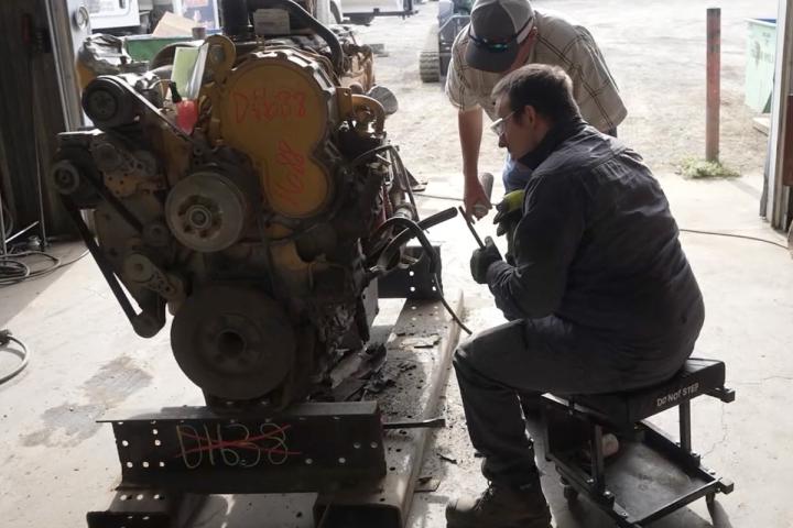 An ICAP participant repairing an engine