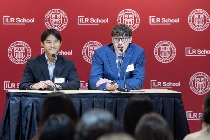 Two High Road students presenting while facing audience