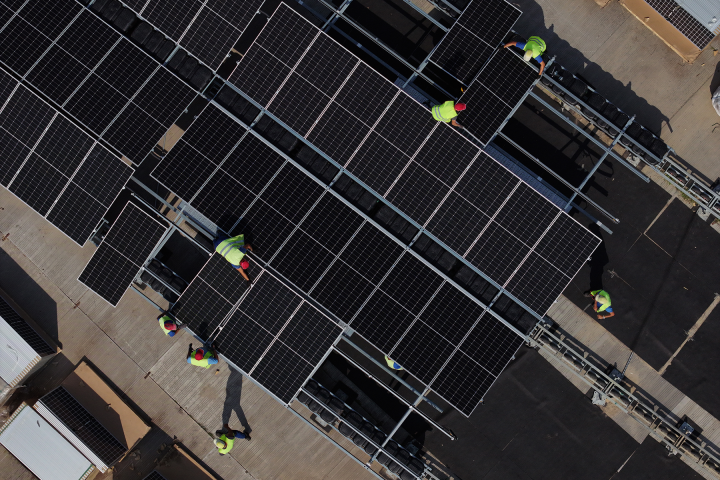 Workers installing solar panels