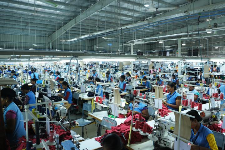 Large room of garment factory workers 
