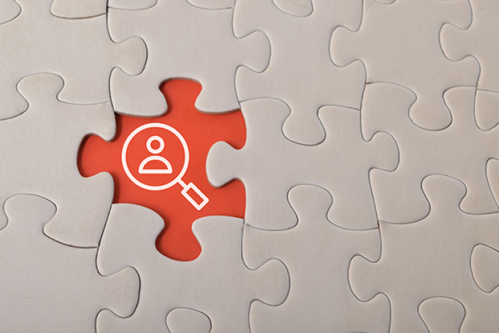 puzzle with magnifying glass in middle