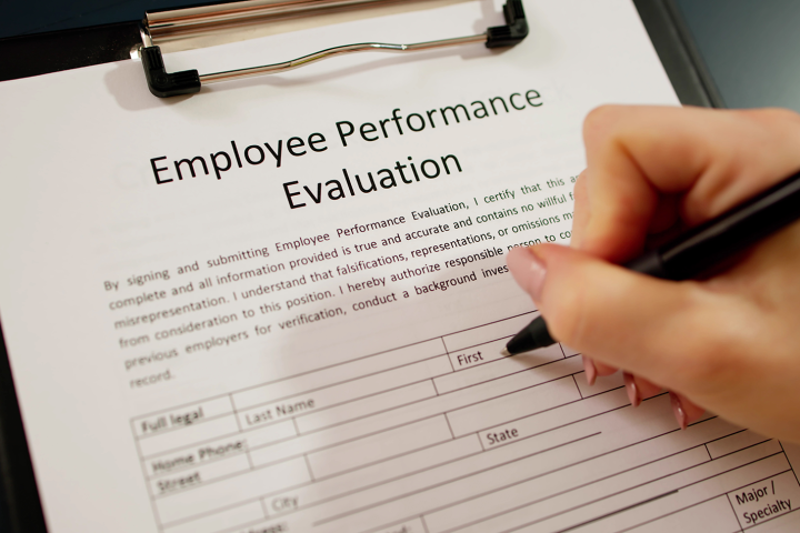 A performance review form being filled out. 
