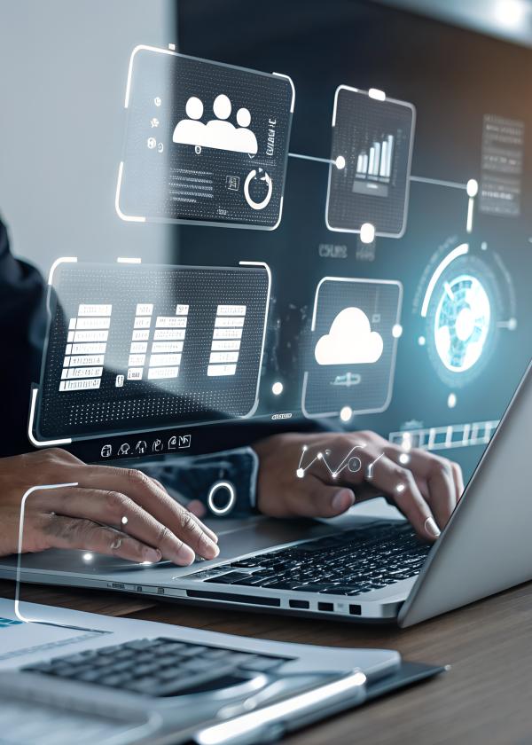 Professional working on a laptop with digital dashboards and data visualizations, representing data-driven decision making and enterprise performance.